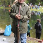 Mallie Daniels looks happy with her large trout.