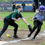 Charge third baseman Hailey Rondeau attempts to tag Bandits runner Lillian Crippen at third base. Of course, the ball must be secured in the hand or mitt for a called-out.