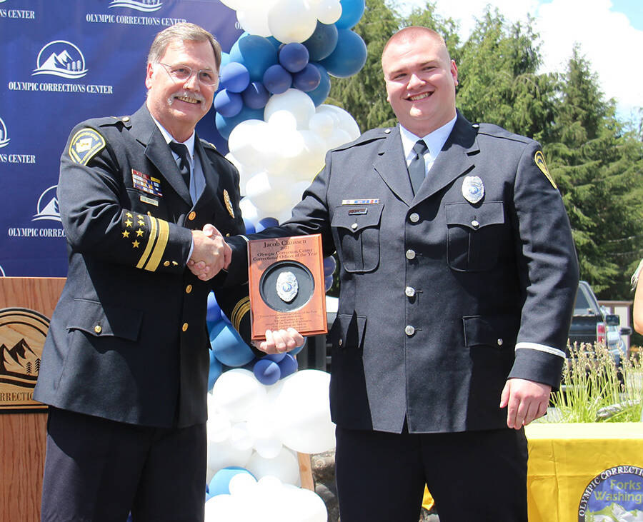 Speers presents Jacob Claussen with the 2023 Corrections Officer of the Year Award. Speers said Claussen leads by example. Photos Christi Baron