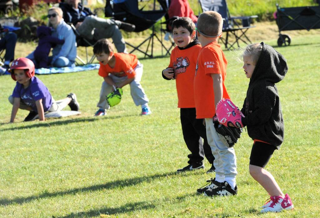 The Tigers infielders in orange had a big decision to make as a Rockies speedster on third was sure to run home on the next hit. Should the play go to home to cut down the runner or should the ball be played to first for a sure out? Sure out? Maybe a time-out should be called to check with the coach.
