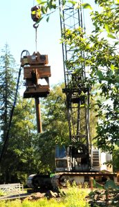 Quigg Brothers, Inc. of Aberdeen began removing the old pilings from the Clallam County Park at Lake Pleasant on Tuesday, July 16. Photo by Lonnie Archibald
