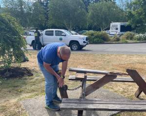 Who ya gonna call …when the picnic table you go to sit on just falls apart? While doing a garden club project last week Janet Hughes and Linda Wells discovered this table had seen better days …a quick call to City Hall and it was Paul Hampton, Public Works Director, on the scene to pull it apart and load it up! Photo Christi Baron