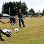 Howard Huskins, age ten, showed good toe-to-ball contact as he was on target.