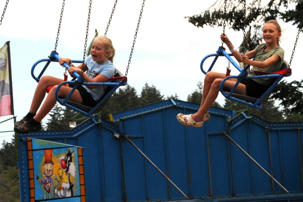 Scottie Fletcher and Aubrey Gale were flying high on one of the many rides at the Fair! Photo Lonnie Archibald