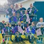 Members of the Forks Happy Tails 4-H group hold photos of their dogs decorated with ribbons won at the Clallam County Fair this past weekend. Top -Ava Baker and Maggie, Leader Carrie Simons, Brooklynn Rondeau with Oliver and Oakley, and Hailey Rondeau with Faith. Middle…Sophie Davis with Dixie, Lillian Crippen with Lambeau. Bottom…Sally Baker with Perry Sue, Hannah Rasmussen with Kodak, Zoie Davis with Belle, Reagan Hull with Trudy and Alice Rasmussen with Luke. Photo Nerissa Davis