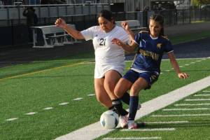 Spartan Skye Hestand went toe to toe with the Ravens on the Spartan Turf in this league contest won by Raymond-South Bend. Photo by Lonnie Archibald