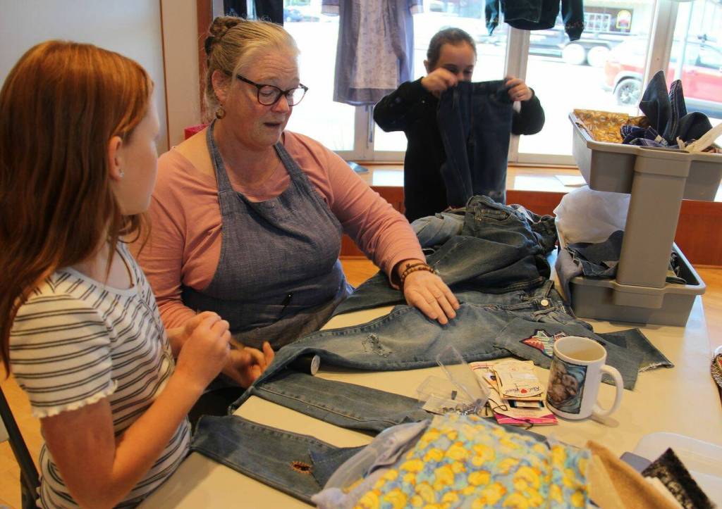 Patsy Brown demonstrates some patching of denim …at the RAC on Saturday.