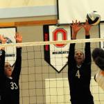 Red Devil Wiinuk Martin (33) goes for the block against Spartan Avery Dilley (11).