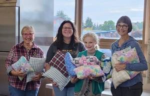 Girl Scout Troop 41844 presented pillows to Soroptimist International of the Olympic Rain Forest at their October meeting. The Girl Scouts made the pillows at Gingers Closet sewing room. They will be part of the comfort kits SIORF assembles and donates to children in emergency foster placement.
Pictured: Sharla Fraker, SIORF, Alyssa Brickey, GS leader, Mackenzie Brickey, GS, and Cindy Mesenbrink, SIORF. Submitted photo