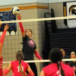 Spartan Erika Williams hits against Ilwaco who Forks defeated 3 to 0 on this Cancer Awareness evening held in the Spartan Gym. Also in the action are Chloe Gaydeski and Keana Rowley. Photo by Lonnie Archibald