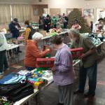Good Samaritan Foundation representatives and local volunteers gathered at the Congregational Church fellowship hall, filling 475 shoeboxes for the Operation Christmas Child program. The team, which included Deborah and Marty Dillion with Don Lawley, completed their work in just two hours on Saturday morning. These shoeboxes, packed with care and Christmas joy, will bring smiles to children around the world. Photo Deborah Dillon