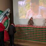 Left, boxes destined for those in need lined the stage area of the Congregational Church fellowship hall last Saturday as a video played sharing the story of Operation Christmas Child. Photo Deborah Dillon