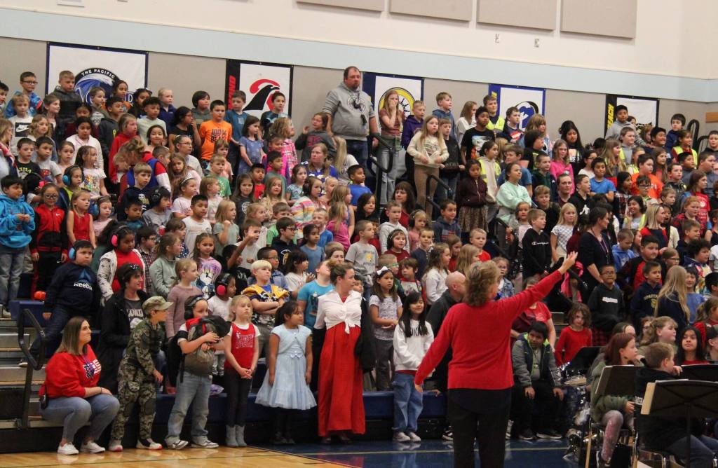 Becky Murillo prepares her students as they entertained at the Assembly.