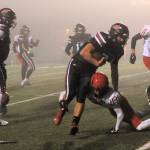 Red Devil Tyler Swan escaped the tackle of this Wahkiakum defender as Neah Bay defeated the Mules on the turf of Spartan Stadium to advance in the state 1B football playoffs. Photo by Lonnie Archibald
