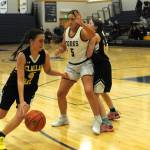 Photo by Lonnie Archibald
Bruin Kaleeka Mendoza McCarty drives around Spartan Peril Salazar while Bruin Helen Smathers sets a screen. Looking on is Spartan Kylie Hull (4). The Forks JVs defeated Clallam Bay 37 to 23 prior to the Forks vs Ilwaco game January 6 in the Spartan Gym.