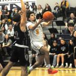 Photo by Lonnie Archibald
DeAnthony Davila drives and scores against the Ravens.