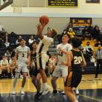 Photo by Lonnie Archibald
Spartan Carlos Soto puts up a shot against Ilwaco who Forks defeated 60 to 51 in JV action. Also in the contest are teammates Gage Willenbrink (3) and Radly Bennett (40).