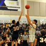 Senior Juan Terrones puts up a shot during Senior Night on Jan. 31 in the Spartan Gym where Forks easily defeated North Beach.