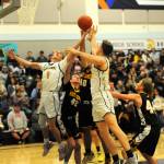 Spartan Seniors Kyle Lohrengel (1) and Brody Lausche (22) rebound before a packed house at Spartan gym on Senior Night.