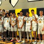 Photos by Lonnie Archibald
The league champion Spartans gathered for team photos after cutting the net, in which they all kept a piece.