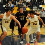 Photo by Lonnie Archibald
In Spartan JV action David Ward (22) and Kaden Ward (23) competed for ball control against North Beach who Forks defeated 68 to 30 in the Spartan Gym.