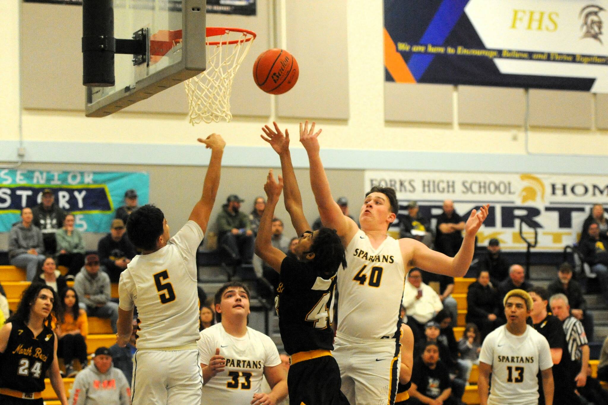 Photo by Lonnie Archibald
Spartan Jvs rebounding against the Hyaks are from left, Cash Barajas (5), Logan Ramsey (33), Radly Bennett (40), and Carlos Soto (13). This was their last home game of the season.