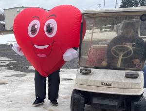Photo Christi Baron
You never know what Jessica Hurley will do for Valentines Day or any other holiday for that matter. But, she was out dressed as a smiling heart and spreading happiness and handing out treats last Friday. Her husband Titus was doing the driving as she had to deflate/inflate a bit each time she got in and out of the golf cart.