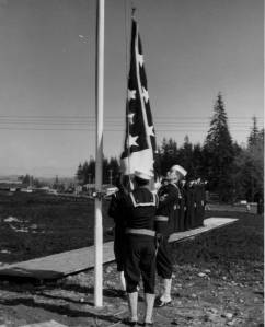 Navy personnel raise the flag at the not-so-secret commissioning ceremony in February 1944. photos Dobbins collection