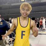 Forks Abraham Montealegre celebrates his state championship at 110 pounds at the Tacoma Dome on Saturday. Montealegre is part of a long line of Forks state champions in wrestling. (Courtesy of Kyle Weakley)