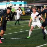 Forks Margarito Gonzalez Black was really using his head on this play while teammate Estevan Ramos (2) looked on. Roughrider is Mathew Miller (10).