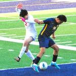 Photos by Lonnie Archibald
Forks Dominick Aranda Santiago (right) challenges Hoquiams Alexander Perez for ball control at Spartan Stadium, where Forks defeated the Grizzlies 5 to 1.