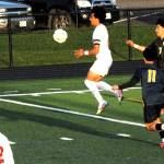 Spartgan Darinel Garcia Lopez (7) was all smiles as he kicked past Grizzlie defenders. Also in the action is Spartan Margarito Gonzalez Black.