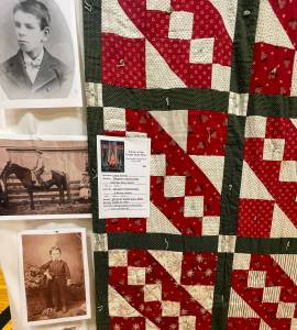 Around 100 quilts were on display over the weekend in the auxiliary gym for the annual Fabric of the Forest Quilt Show. Some were new creations and some were very old. This quilt made in 1870 is a family treasure owned by Laura Farrell complete with family photos. 
Photos Christi Baron