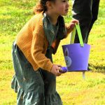 Four-year-old Addisyn Moody was thinking ahead as she searched for more eggs while still in the process of placing one in her basket.
