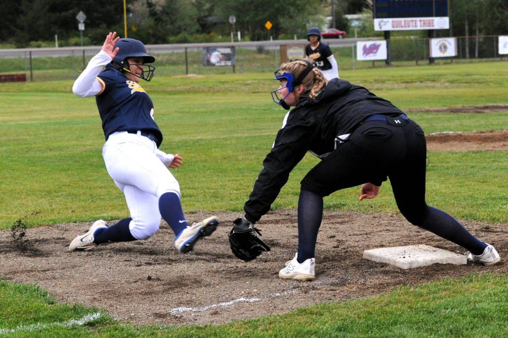 Photo by Lonnie Archibald
Spartan Lilian Jacobson steals third in the second game in which hits and runs were many for Forks.