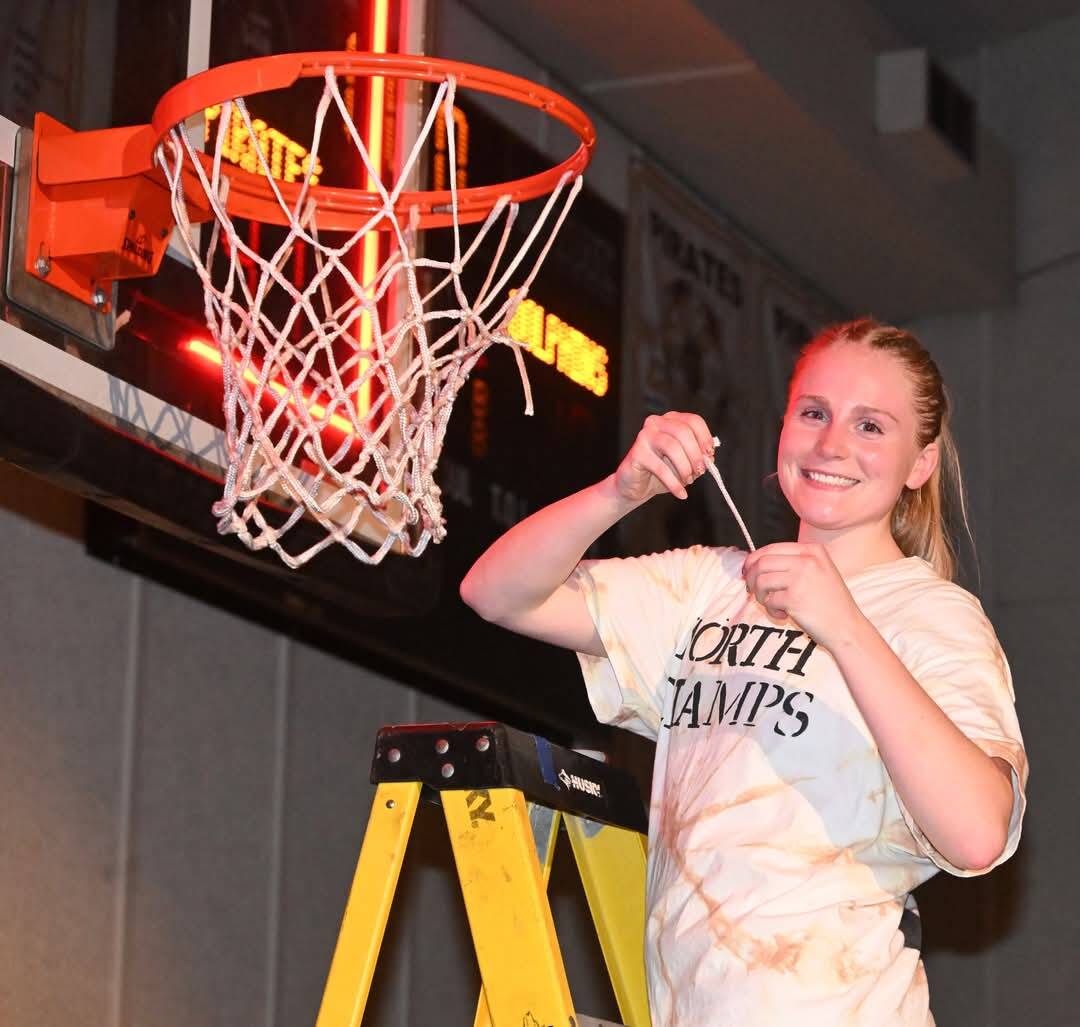 Peninsula Pirates Athletic Department
Kadie Wood cuts down the net after her Pirates went 14-0 in conference play to win the NWAC Northern Division.