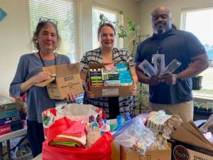 Soroptimist International of the Olympic Rain Forest recently delivered hygiene supplies to the Hope Center and Mariposa House. Pictured here with boxes of supplies are the Hope Center case managers: Jessica Mishler, Christine Lee and Kevin Moody.