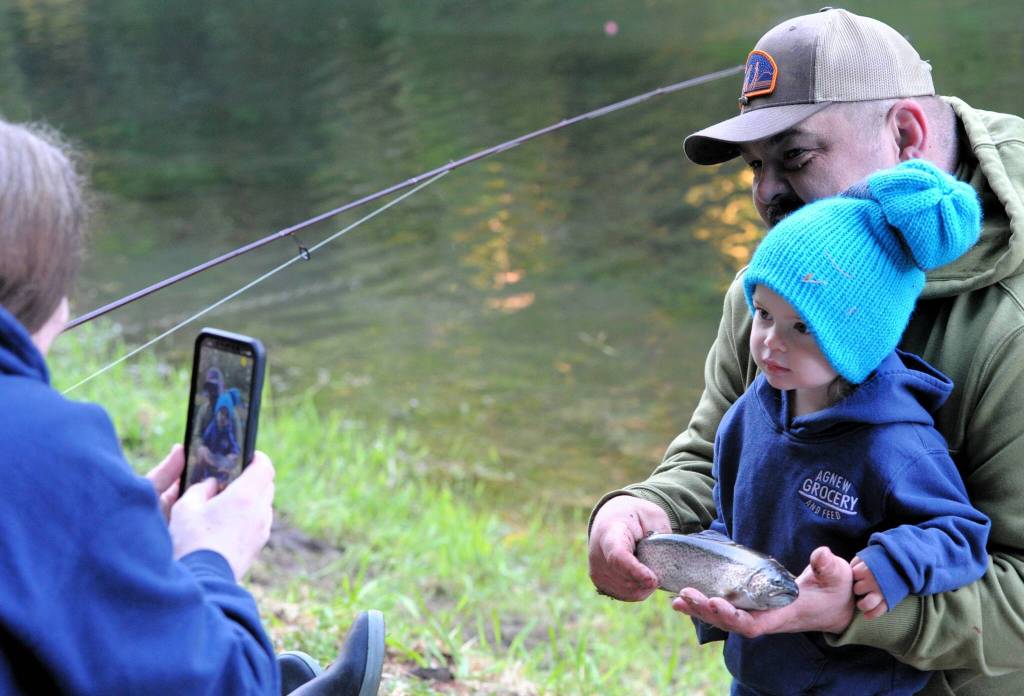 With the help of Gary Iotte, Solomeina Soha, age 2, took time out for a photo moment by mom.