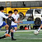 Mateo Lucas (13) kicks towards the goal against the Eagles.