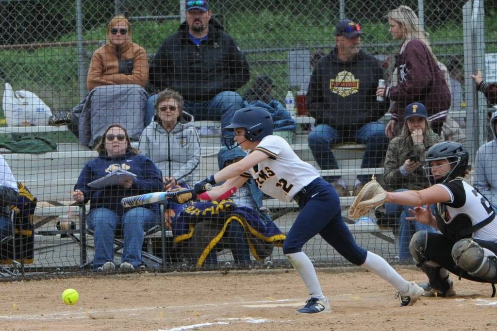 Forks Kinley Rondeau lays down a bunt against Rainier.