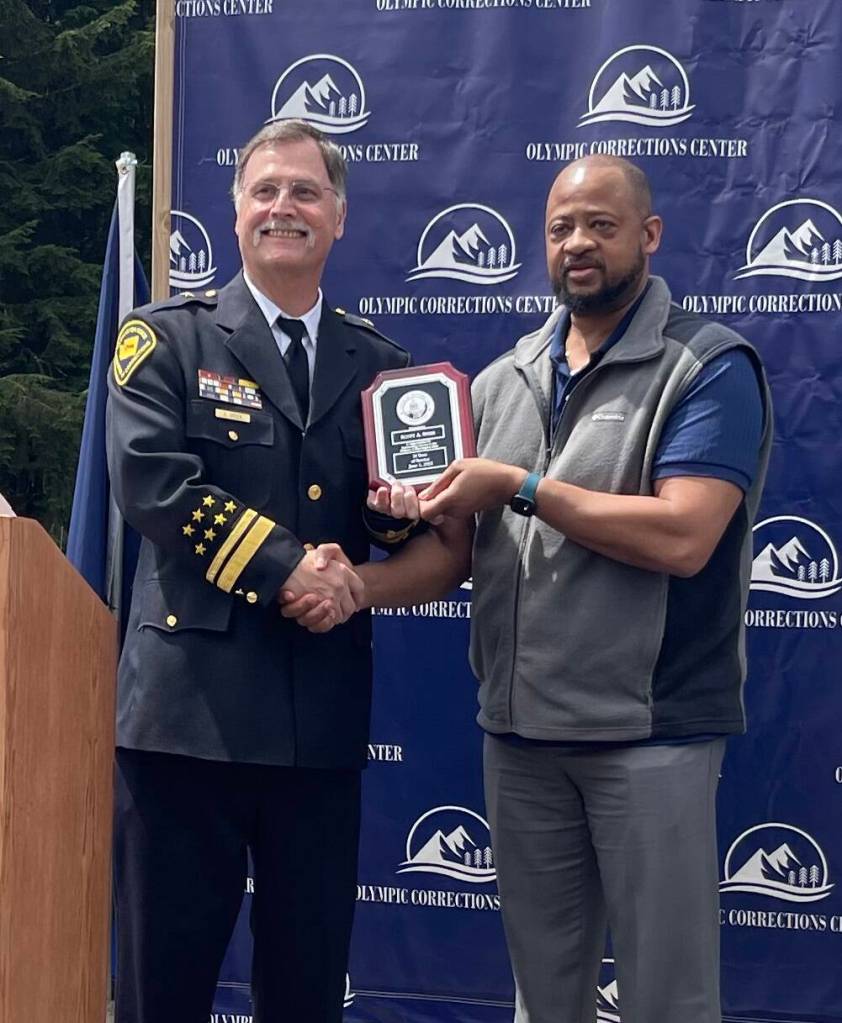 In recognition of Scott Speers upcoming retirement, Deputy Assistant Secretary of Prisons, Eric Jackson, presented Speer with a plaque and many complimentary words.