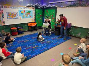 The cozy reading nook at the FES library, librarian Cathy Johnson reads while the children listen and help figure out who is eating the garden. 
Photos 
Christi Baron