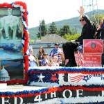 Photo Lonnie Archibald
Hometown Hero Richard Halverson waves to the Grand Parade crowd on the 4th. Halverson joined the National Guard while he was still in high school and served from 1963-1969. Richard has volunteered for the Forks Chambers Logging and Mill tour and served on the boards of the Forks Timber Museum and the West End Historical Society.