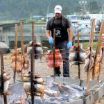 Photos by Lonnie Archibald
With the LaPush Marina in the background, Matt Payne and Smokey Ward keep close eyes on the salmon during the traditional salmon bake on Saturday during Quileute Days in LaPush. More photos page 3.