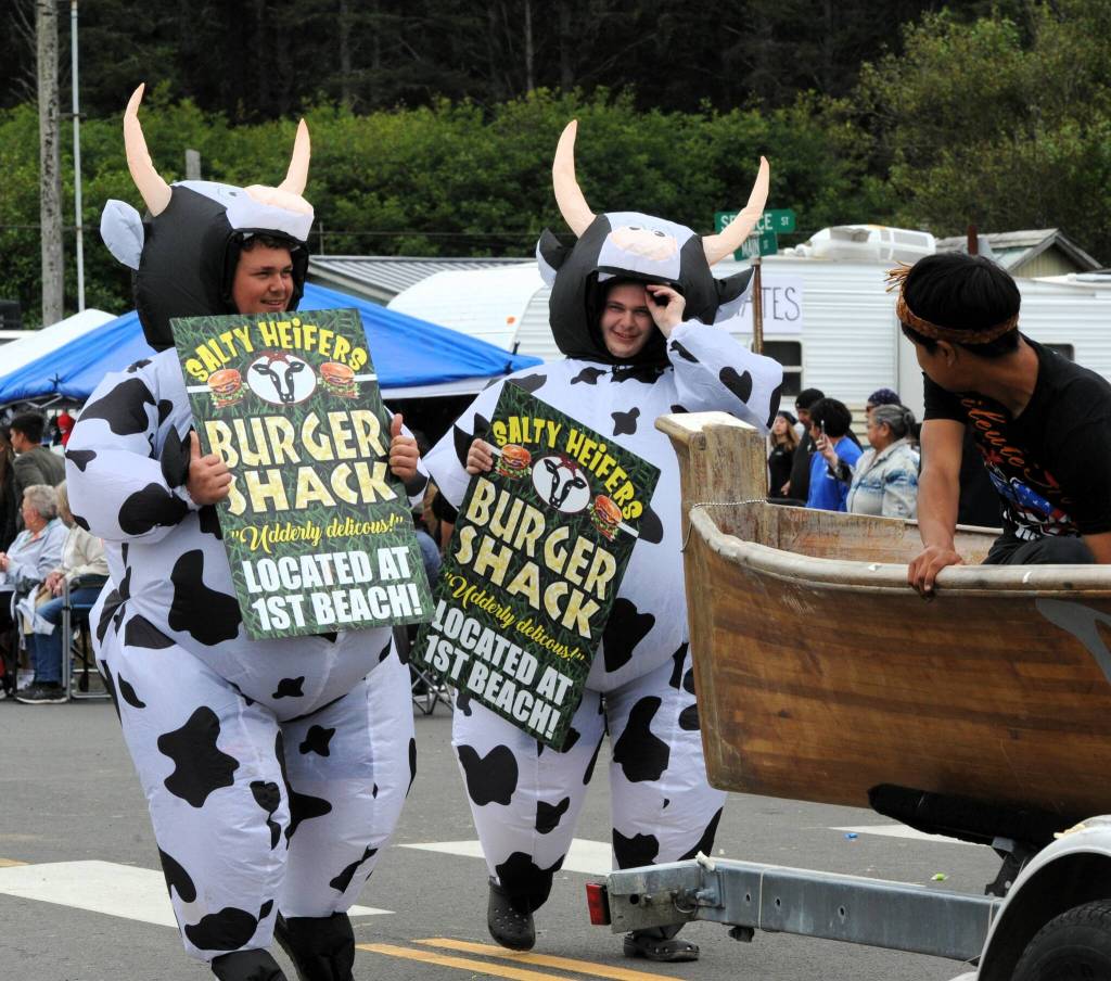 The Salty Heifers Burger Shack participants mooo-ved through the parade following the Quileute Tribal Canoe.