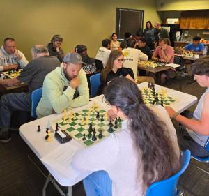 Photo courtesy of NOLS.
First-place winner Don Panico, top left, competes against third-place winner Steve Dalman. Second-place winner Sophie is pictured at the center.