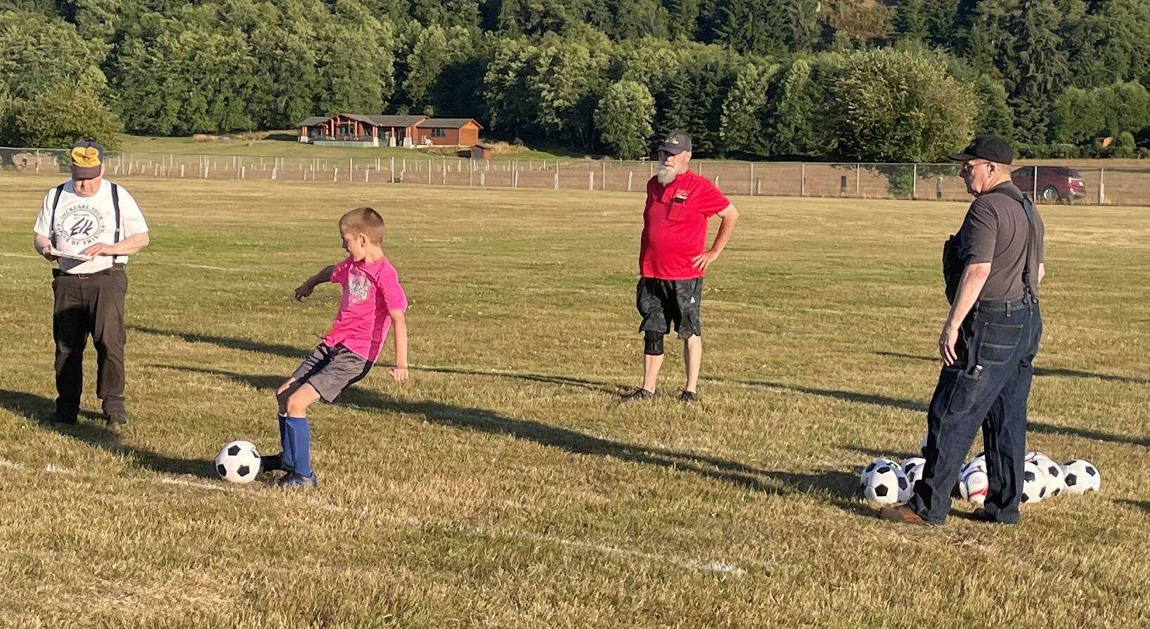 The Forks Elks recently hosted their annual Soccer Shoot. Chuck Jennings, Mike Leavitt, and Don Leavitt look on as a contestant takes a turn. Forty-four participants took part. Photo Teri Leavitt