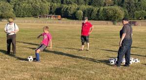 The Forks Elks recently hosted their annual Soccer Shoot. Chuck Jennings, Mike Leavitt, and Don Leavitt look on as a contestant takes a turn. Forty-four participants took part. Photo Teri Leavitt