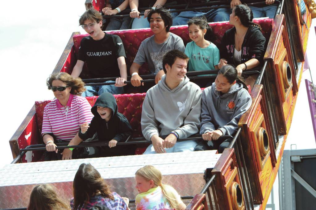 Neah Bay basketball athletes Eckos Chartraw and Caylee Moss, lower right, enjoying a day at the fair on the Pirate Ship.