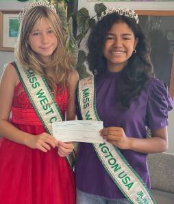 These busy ladies, Ryerlin Roland and Elizabeth Graeme, recently accepted a $100 check from the Forks Old Fashioned 4th of July Committee. Their Grand Parade entry was the lucky winner of the random drawing held for all registered participants.